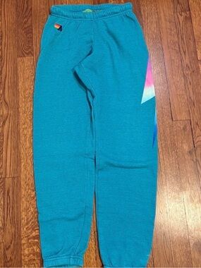 Aviator Nation Teal Sweatpants with Rainbow Lightning Accent